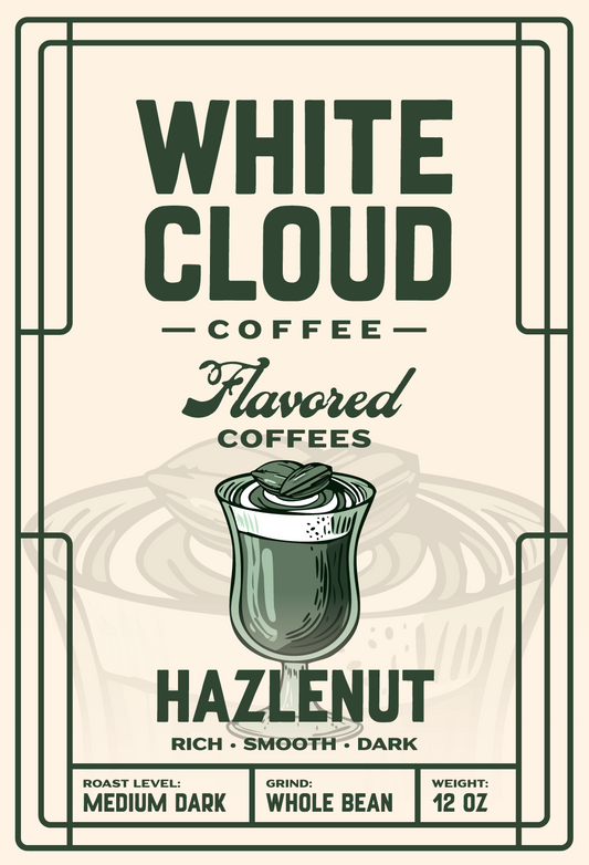Hazelnut flavored coffee from White Cloud Coffee, medium dark roast with topped-glass artwork
